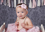 Luciana- Pink Flower on a pink, grey, and white braided headband