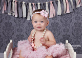 Luciana- Pink Flower on a pink, grey, and white braided headband