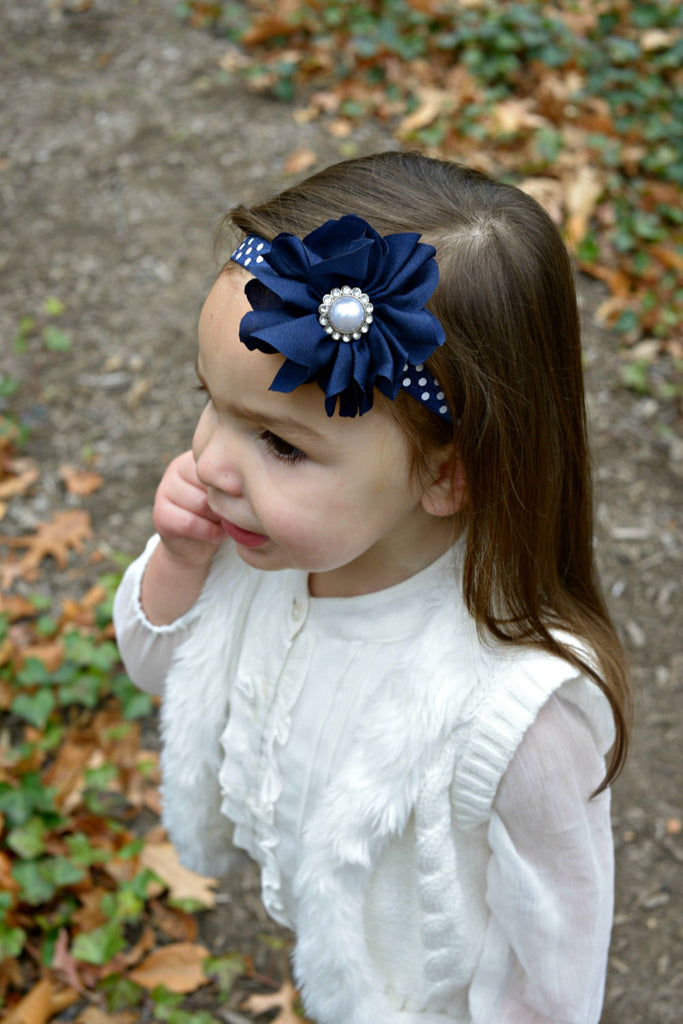 Penelope- Navy flower with pearl on a polka dot headband